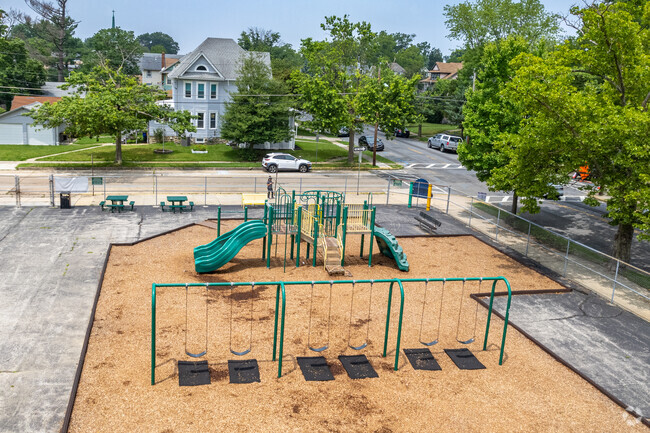 Fenced in playground with swingsets at Mansion Ave School in Audubon, NJ.
