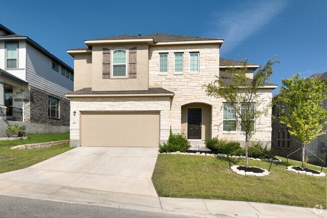 Many homes in Timberwood Park feature classic brick masonry façades.