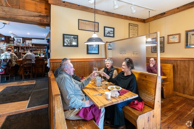 Folks celebrate an afternoon meal at Tooky Mills Pub, ten minutes from Deering.