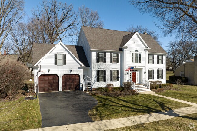 Colonial revival home with attached two car garage located in Downtown Palatine.