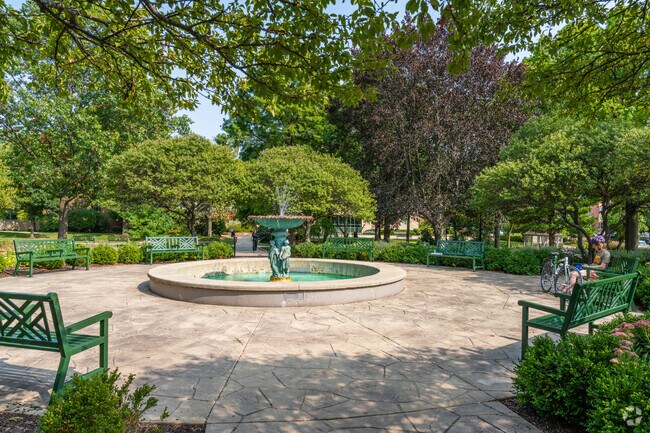 Adams Park features a central fountain and ADA-accessible pathways in Downtown Wheaton.
