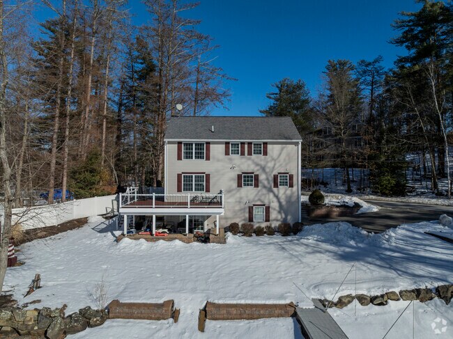 Classic and full of character, this New Englander on Arlington Pond blends history, charm and timeless architecture.