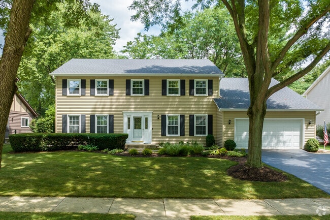 Colonial-inspired homes in the Hobson Village neighborhood offer two-car garages & mature trees.