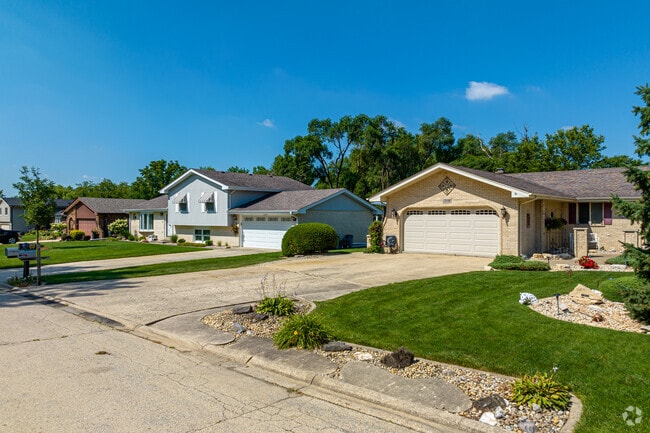This beautiful row of homes displays popular home styles in the Sandburg neighborhood.