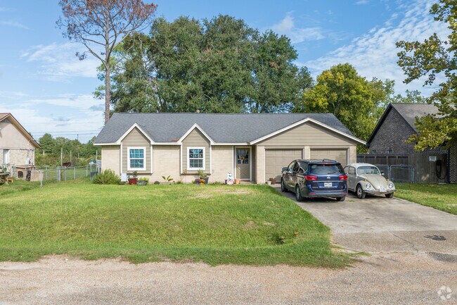 Single-story home with a two-car garage sits on an ample-sized lot in Danbury.