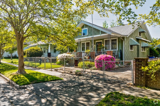 Beautiful azalea bushes line the patio of this bungalow home in Estabrook.
