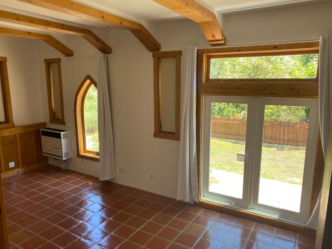 Vaulted ceilings and double front doors.