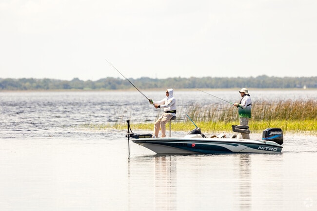 Near Boggy Creek, enjoy peaceful fishing at Ralph V. Chisholm Park, with serene lakeside views.