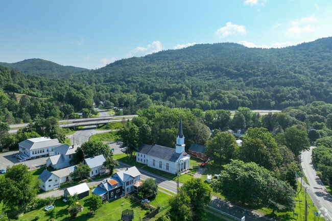 In Sharon, churches blend into a wooded landscape at the town’s core.