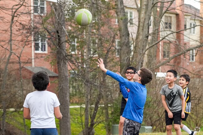Kings Park West Townhomes basketball court is a great place for kids to play.