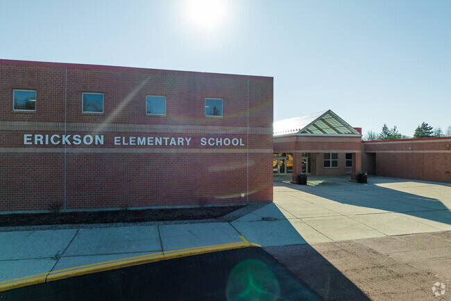The Erickson Elementary School front entrance features a brick architecture.
