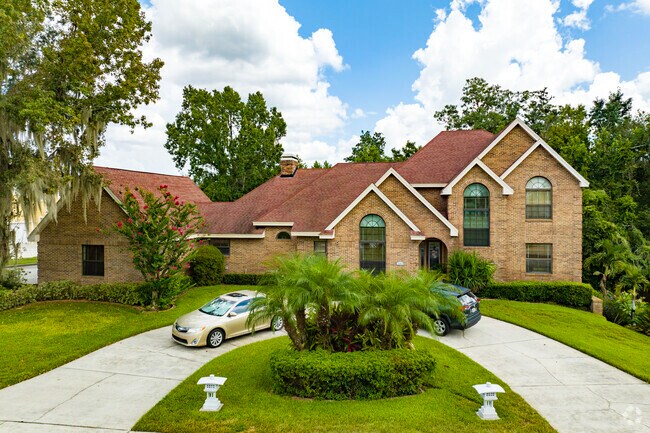 This iconic home in Riverview sits on a lovely lot with nice landscaping.
