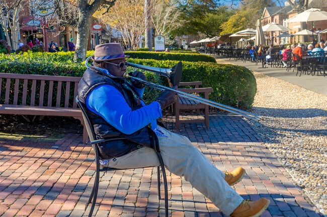 Talented residents occasionally play music throughout Forest Hill Park.