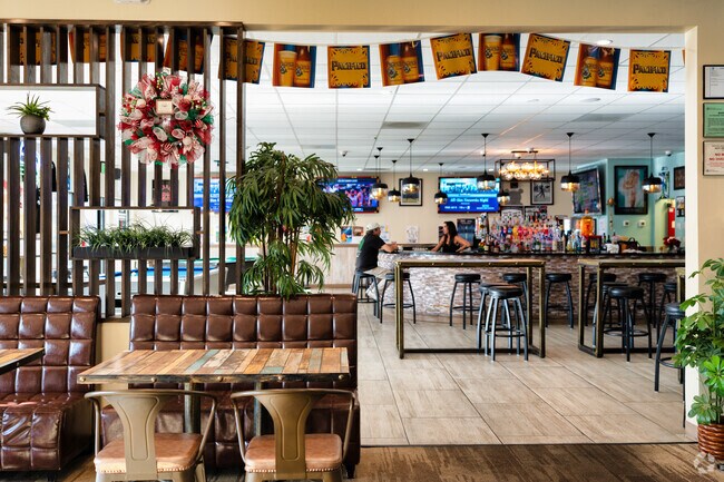 Watch the game while having a pint at District 1 near Pinewood.