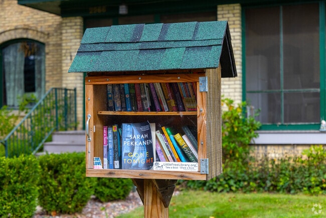 Families swap books at East Troy’s neighborhood library box.