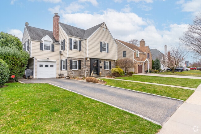 Multistory colonials and well manicured lawns adorn the streets of Garden City.