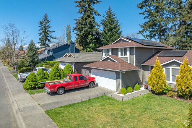 Large contemporary homes nestled among fir trees are common in Madrona Meadows.