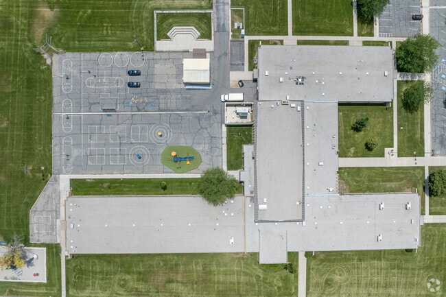 Twin Peaks Elementary School is surrounded by green lawns.
