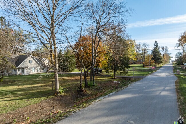 Older homes sit on tree covered larg lots in a section of Southeast Geneva.