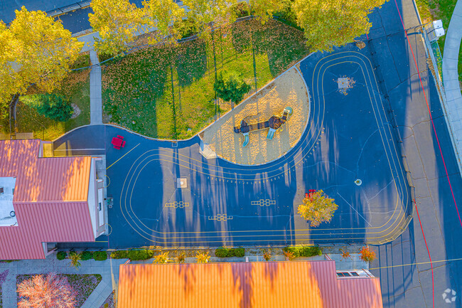 Little ones love to play on the asphalt track at Rock Creek Elementary School.