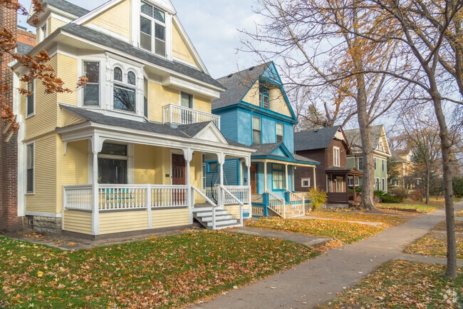 A row of new traditional Victorian-style homes.