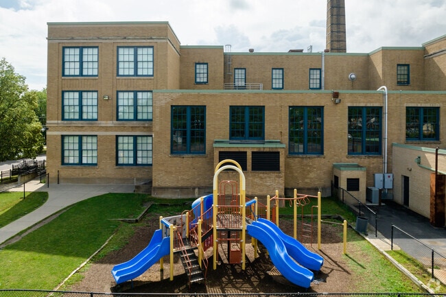 PS 82 Early Childhood Cen in Buffalo has private playground on the side of the main parking lot.
