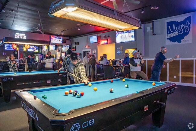 Mugsy's Pub and Patio in Lincoln Village has several pool tables and dart boards.