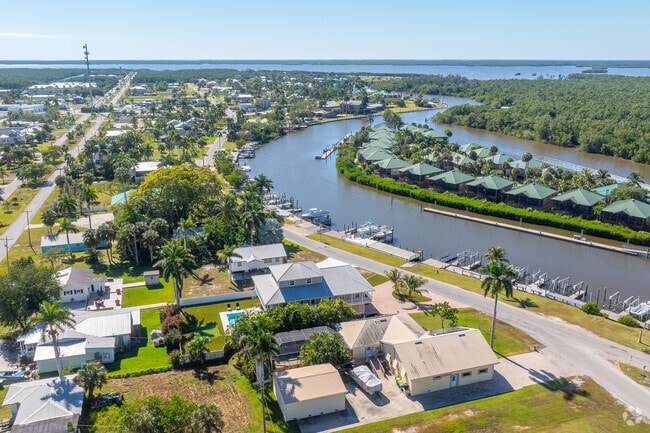 Everglades City community blends stilted homes with lush tropical scenery.