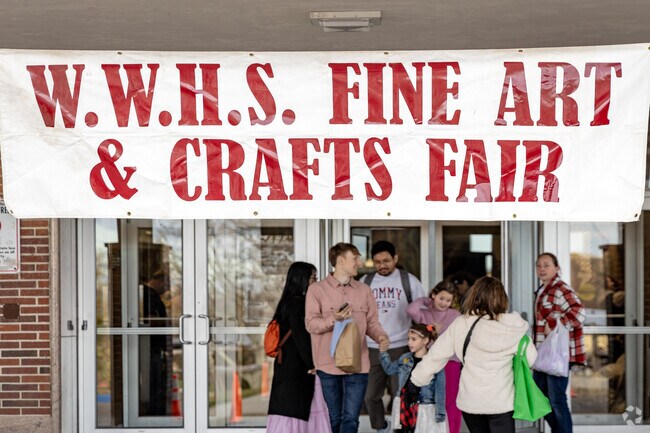 The sign welcomes shoppers to the Walt Whitman Fine Art & Crafts Fair.