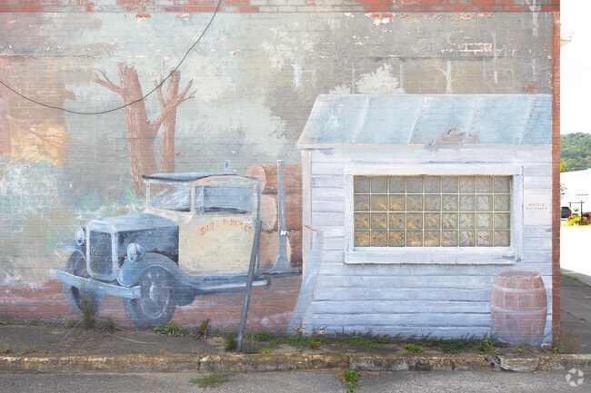 A colorful mural of a classic truck brightens downtown.