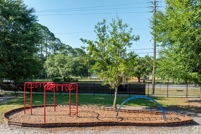 Children climb the monkey bars at St. Patrick Interparish School.