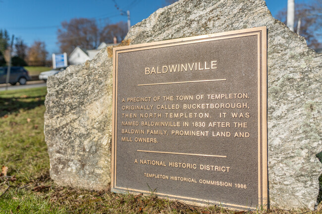 A historical plaque summarizing the various names Baldwinville has had throughout time.