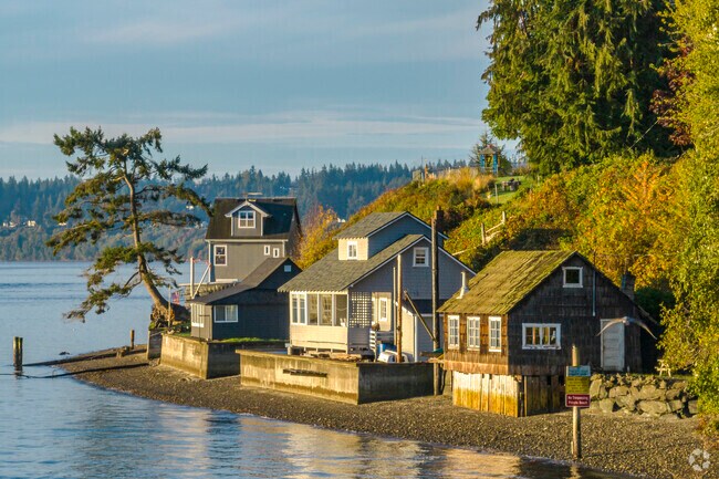 Coastal bungalows sit along the beach by Sunrise Beach Park.