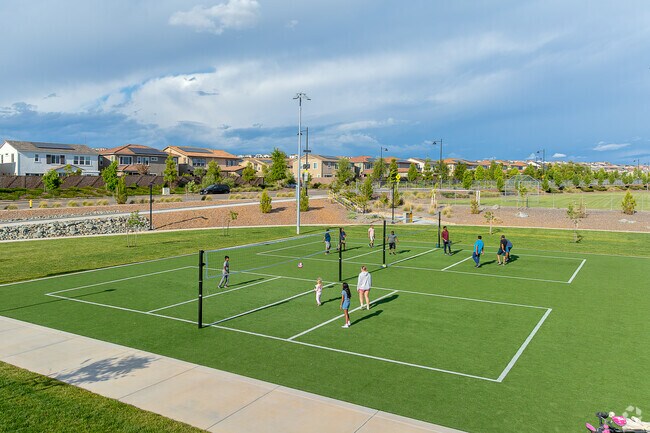 Neighbors gather at Prospector Park for a game of volleyball.