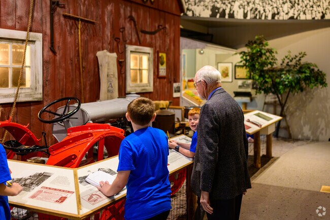 A docent answers a student's questions at the Michigan History Center in Downtown Lansing.