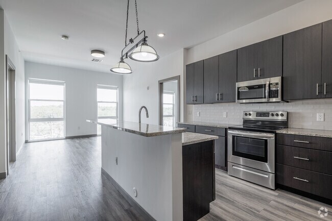 2BR, 2BA - 1,052SF - Kitchen and Living Room