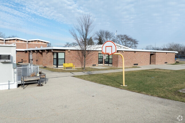 Basketball courts are Sherwood Elementary School are losing space to mobile classroom set ups.