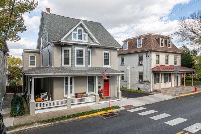 Houses with hints of Colonial and Second Empire sit side by side near West Cornwall.