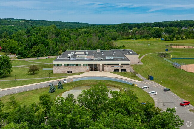 Lansing High School has a pond out front.