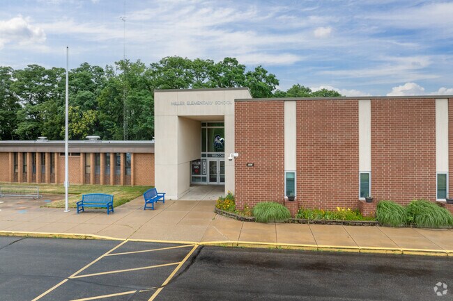 Thomas Miller Public Elementary School is surrounded by tall trees in the hills of Lafayette.