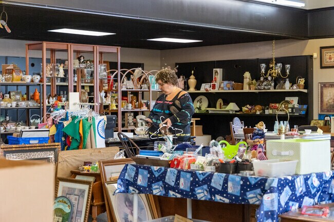 Highlands bargain hunters browse clothing, furniture, and gift items at The Collective Thrift Store.