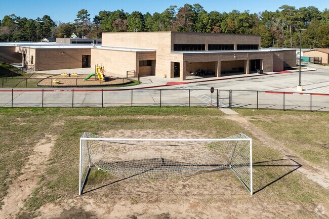 Kids enjoy playing soccer during recess.
