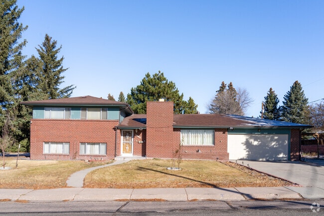 A classic brick home in Indian Hills, offering comfort and charm in a quiet, scenic setting.