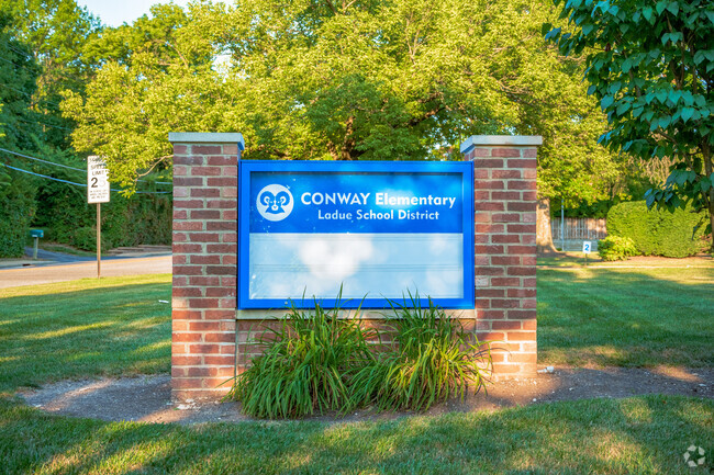 Conway Elementary School sign welcomes students to the school.