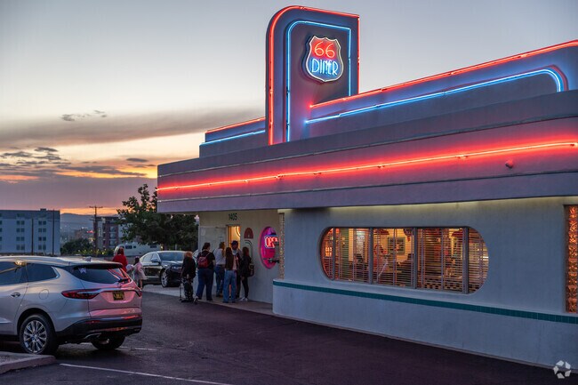 66 Diner lights up the evening with neon flair near Silver Hill.