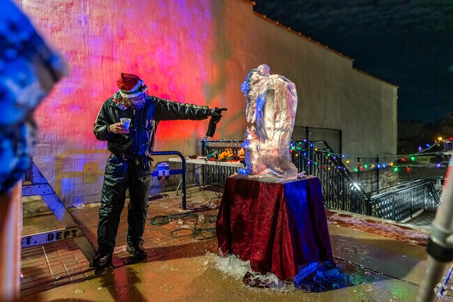 The ice sculptor is very impressive at Frosty Fest in Chicago West.