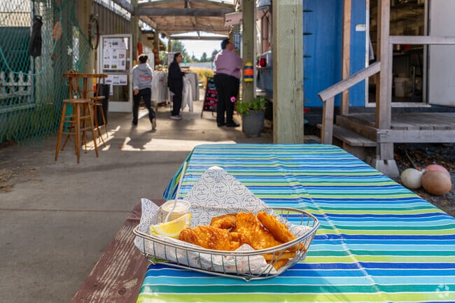 Residents line up to eat at Ship Out Fish N' Chips in Jeffers Garden.