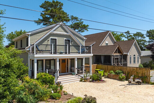 Single-family homes in Dewey Beach come in a variety of styles and have shaded front porches.