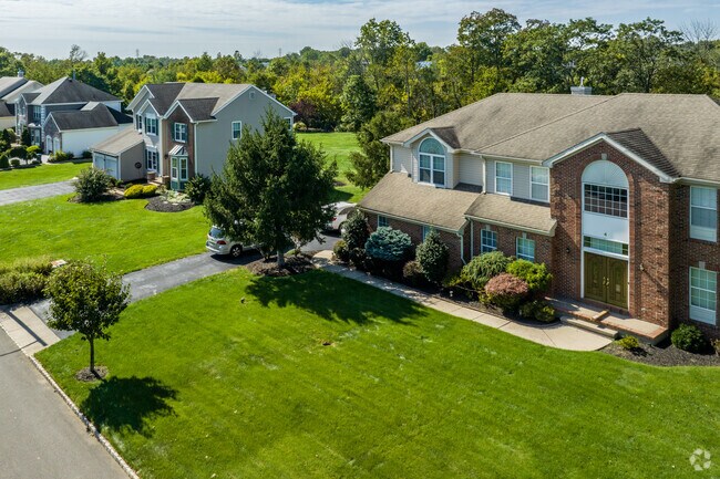 Large brick-faced Colonial homes are ideal for family living.