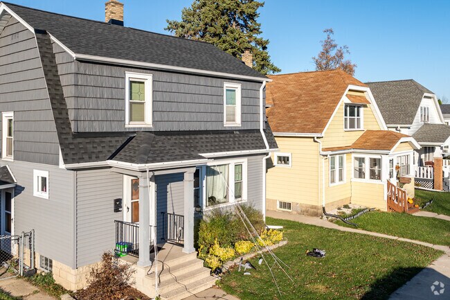 A row of spacious and charming homes line the street in Drexel Highlands.